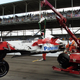 Workers collect Ralf Schumacher’s Toyota after it blew a left-rear tire at the 2005 US GP.